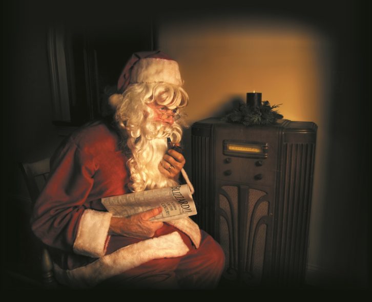 Santa listens to an antique radio
