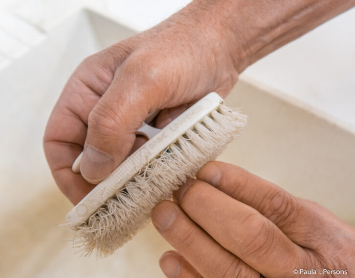 Use a nylon brush to remove dirt from under fingernails