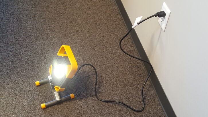 This larger AC-powered LED lamp replaces the traditional incandescent trouble light.