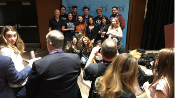 Attendees at the National Electronic College Media Convention in 2018 celebrate an award for KTSW(FM) in Texas in an image from the CBI Twitter feed.