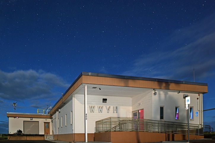 The WWVH building seen at night.