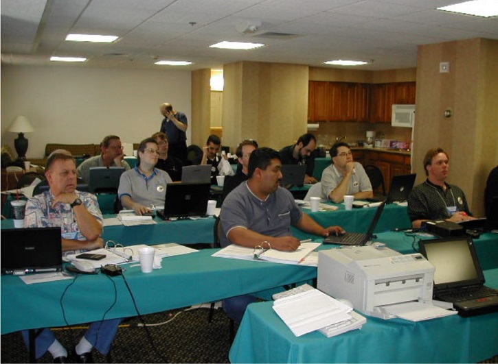 Attendees listen at a John Furr symposium in 2002. 
