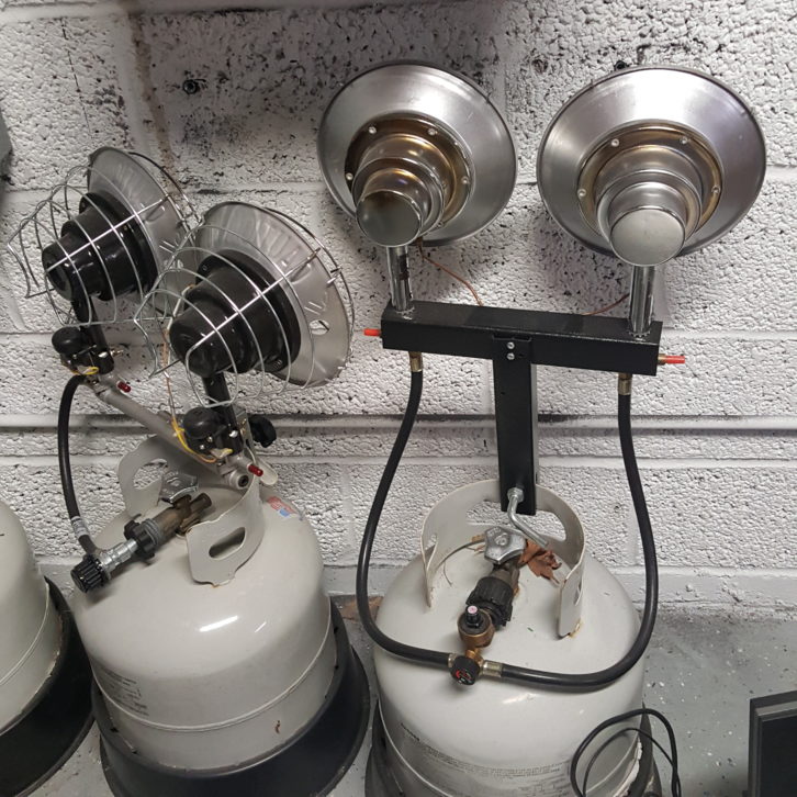 Portable propane tank-mounted heaters