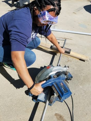 Zipporah Mondy cuts stainless steel pipes for an antenna bay during her apprenticeship in 2018 for Smile FM.
