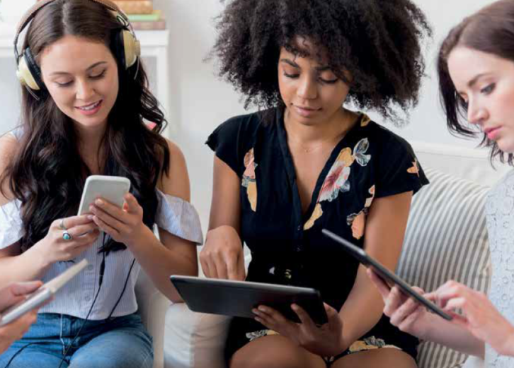 young people listen on devices Getty Images JGI Jamie Grill