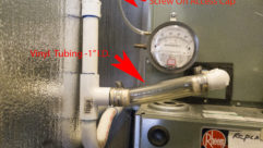 Fig. 2: A screw-on drain cap and a see-through section of tubing help guard against wet encounters caused by clogged condensate drains.