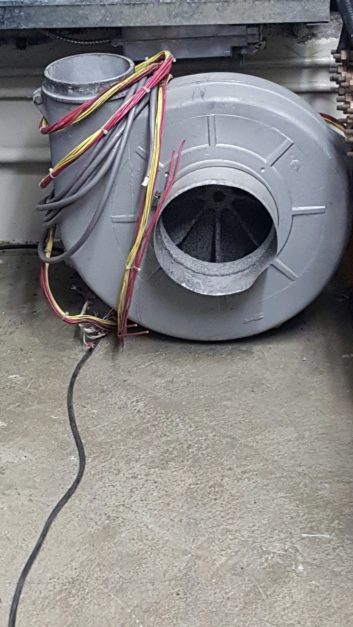 A spare transmitter blower with wiring harness.