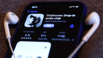 Clubhouse Drop-in audio chat app logo on the App Store is displayed on a phone screen