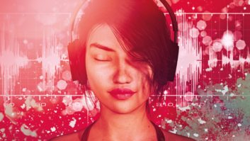 Young woman listening to headphones with eyes closed