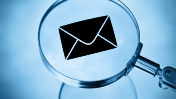 Email symbol under magnifying glass