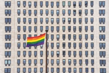 Rainbow flag in front of a corporate office