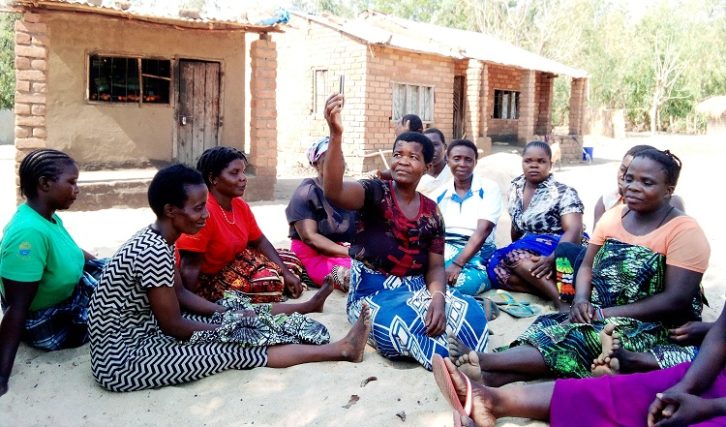 Women in Vithenja village listening to Nkhotakota Radio Youth Health Program in Malawi