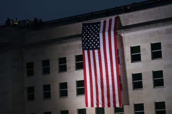 An American flag is shown unfurled at the Pentagon in 2018 to mark the anniversary of 9/11. Nearly 3,000 people died in the terror attacks.
