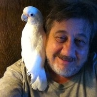 Fred Weinberg and a pet bird