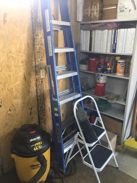 Photo of the author's workshop with a ladder, tools and documentation shelf