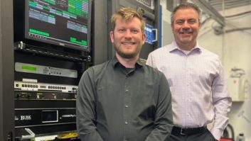 Andy Gunn and Rob Bertrand in front of equipment racks at WAMU