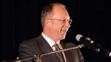 Wyatt Thompson speaks at a podium