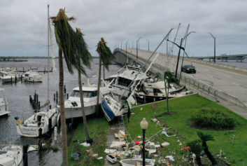 Boats are pushed up on a causeway after Hurricane Ian passed through in Fort Myers, Fla.