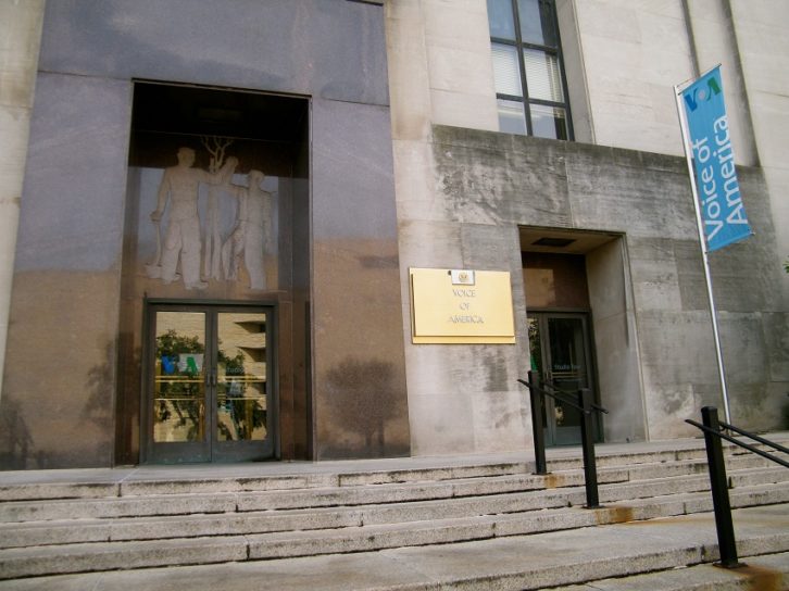 Entrance to the Wilbur J. Cohen Federal Building with VOA sign visible