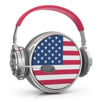 Concept image of a sphere decorated with the US flag, wearing a broadcast headset, suggesting partnership of the military with broadcasters