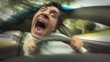 A stylized photo of an upset male car driver with eyes bugged out and mouth open in a scream