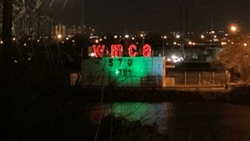 WMCA transmitter building at night with call letters illumiinated in red