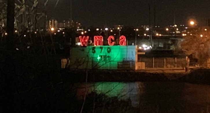 WMCA transmitter building at night with call letters illumiinated in red