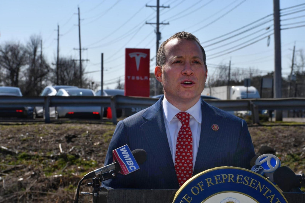 Representative Josh Gottheimer speaks at a press event near a Tesla dealership in Paramus, New Jersey