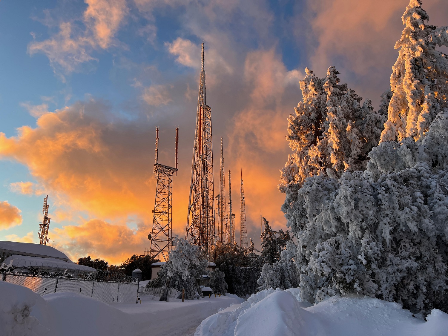 Sunset photo of snow on the Mount Wilson tower farm in California