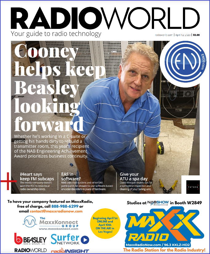 Cover of Radio World April 12 2023 issue with a photo of Mike Cooney working on his hands and knees in a transmitter room