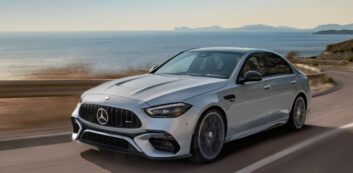 Photo of a 2024 Mercedes AMG C 63 S E model on a highway by the ocean