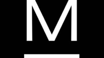 Logo of Multimedios, a white letter M on a black background