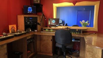 WXOX’s Studio A,painted in red, looks into a performance area through a custom window.