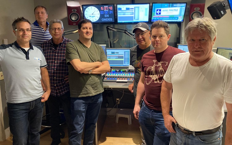 Members of the technical team stand in one of the completed studios.