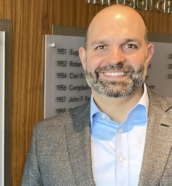 Curtis LeGeyt standing in a lobby of the headquarters of the National Association of Broadcasters in Washington DC