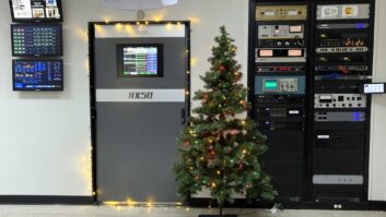 The transmitter room of WLS(AM) radio station in Chicabo with a Christmas tree in front of the Nautel transmitter