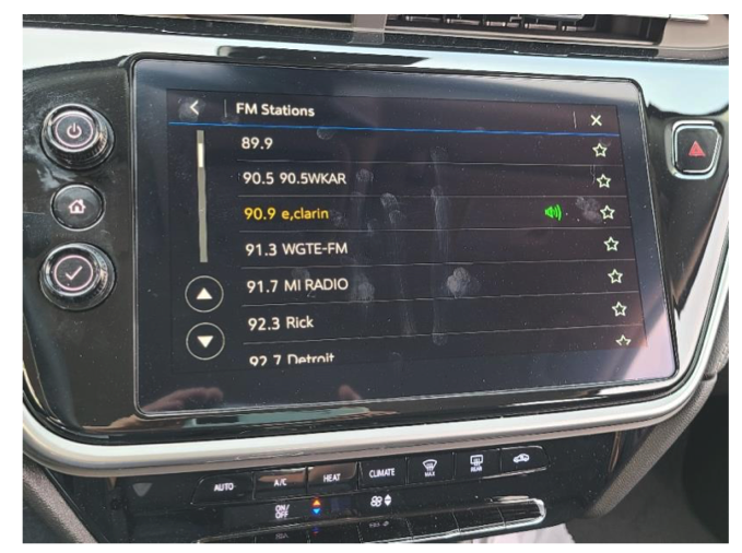 Radio display in a 2023 Chevy Bolt showing a station list that uses RDS PS field information. 