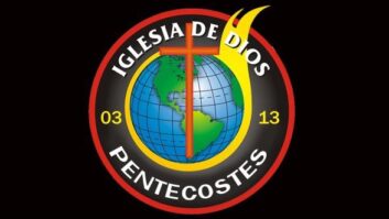 Logo of Iglesia de Dios Pentecostes, an image of the globe on fire, with a cross in front of it