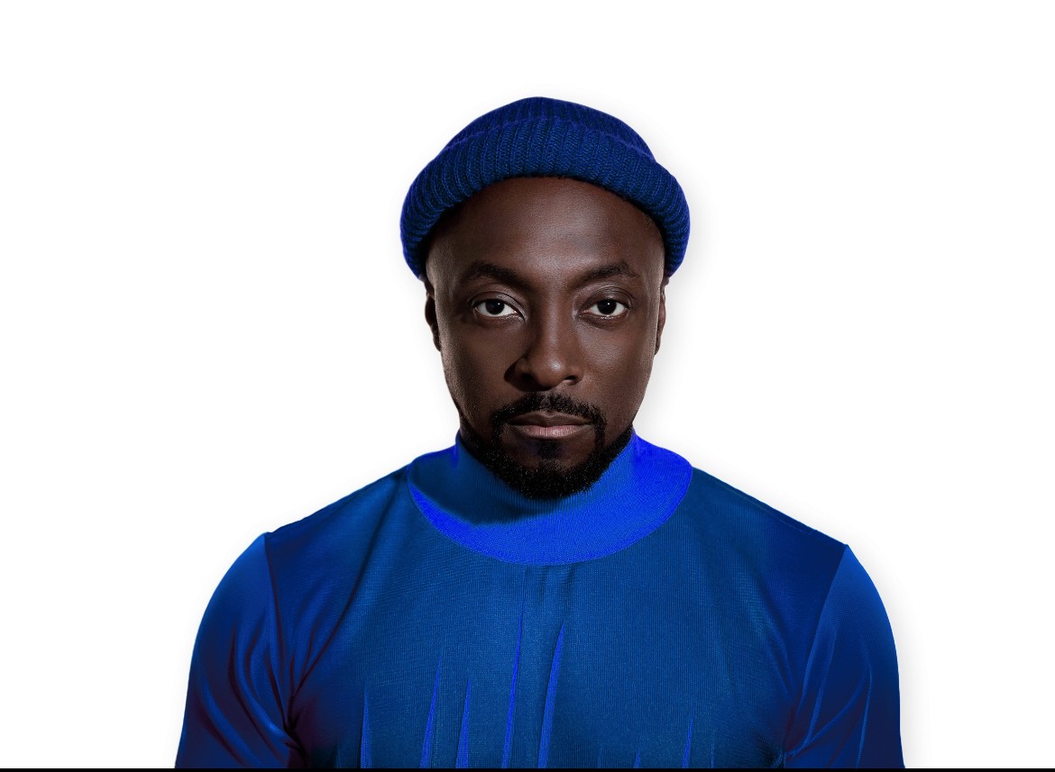 Headshot of the musician and businessman will.i.am wearing a blue shirt and hat