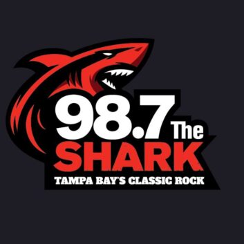 Logo of "98.7 the Shark" with a conceptualized red and black shark