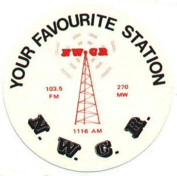 A promotional button for NWCR, from the website dxarchive.org.