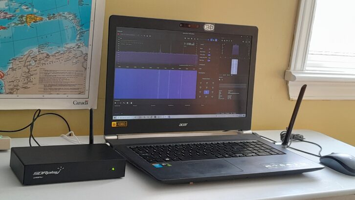 The active nRSP-ST, connected to a laptop. The SDR hardware is roughly 8 x 4 x 2 inches and weighs under two pounds.