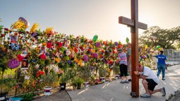 Residents grieve and pay their respects at a memorial in Kerrville, Texas.