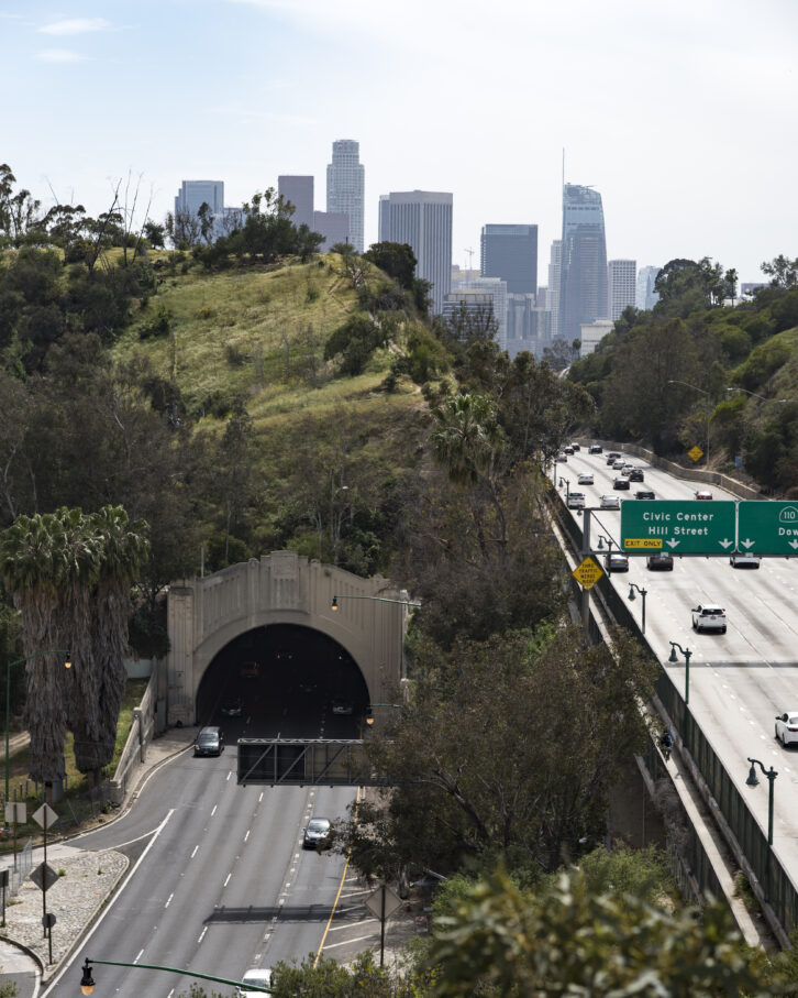 The Pasadena or Harbor Freeway leading into downtown Los Angeles on a hazy day.