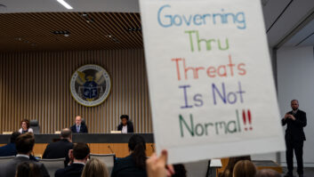 FCC commissioners Anna Gomez, Brendan Carr and Olivia Trusty at Tuesday's open meeting during which protestors briefly interrupted. Photographer: Kent Nishimura/Bloomberg via Getty Images