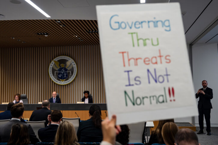 FCC commissioners Anna Gomez, Brendan Carr and Olivia Trusty at Tuesday's open meeting during which protestors briefly interrupted. Photographer: Kent Nishimura/Bloomberg via Getty Images