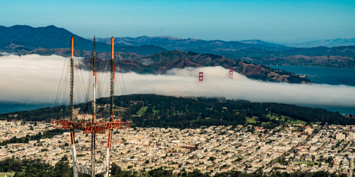 With the Golden Gate Bridge shrouded by the city’s trademark fog, Sutro Tower stands tall over San Francisco. Credit: Steve Proehl/Getty Images