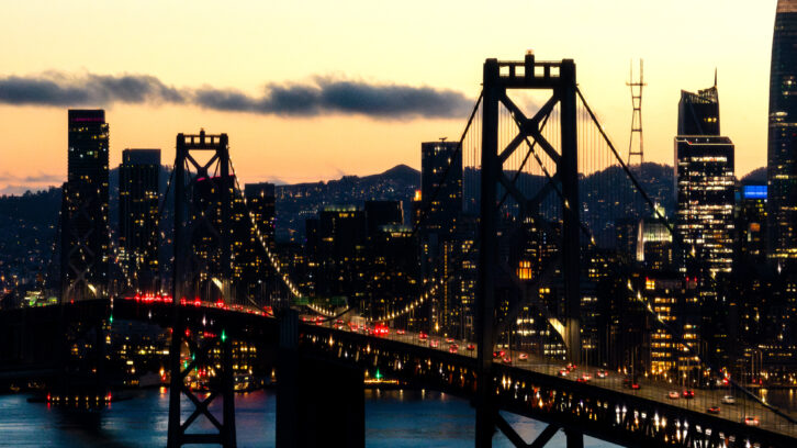 Looking towards downtown San Francisco with the San Francisco-Oakland Bay Bridge and Sutro Tower in the background. Credit: JasonDoiy/Getty Images. 