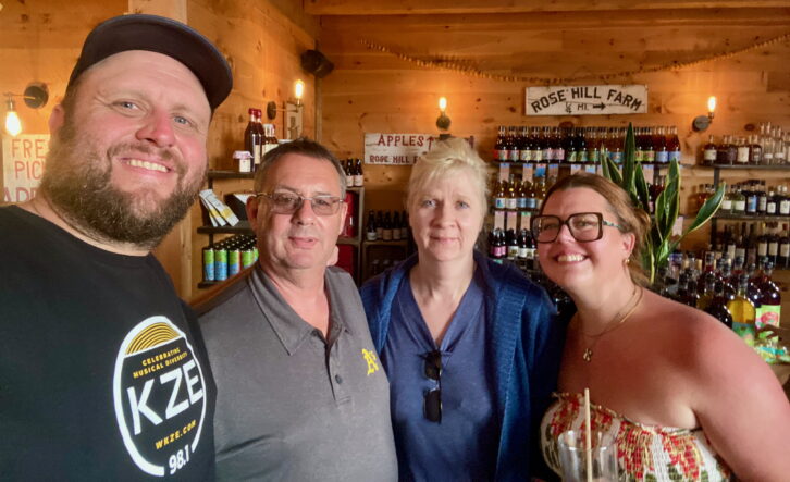Andy and Katie Gladding, left and right, are with Neversink Media Group owner Bud Williamson and his wife Juli at WKZE’s “Frolic at the Farm” concert at Rose Hill Farms in Red Hook, N.Y., in August.