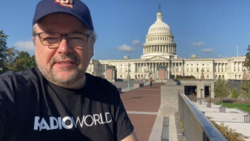 Paul McLane stands in front of the US Capitol's east face, wearing a DC hat and a Radio World T shirt